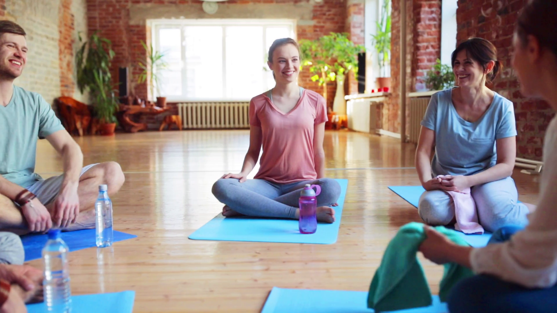 videoblocks-fitness-sport-and-healthy-lifestyle-concept-group-of-people-in-yoga-class-resting-on-mats_rybutusiae_thumbnail-full01